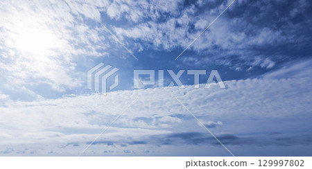 Blue Sky with Scattered Clouds on a Clear Sunny Day Blue Sky with Scattered Clouds on a Clear Sunny Day 129997802