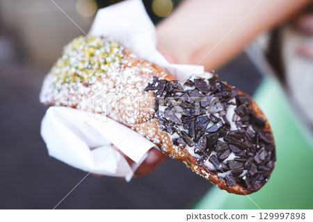 Close-up of cannoli, a traditional Sicilian dessert 129997898