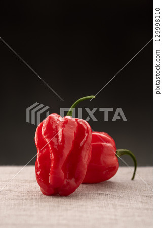 Red Habanero Pepper With Dark Background 129998110