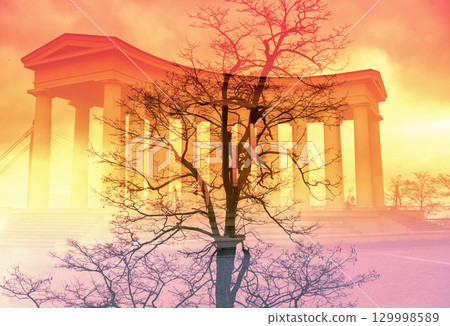 A building with a sunset in the background 129998589