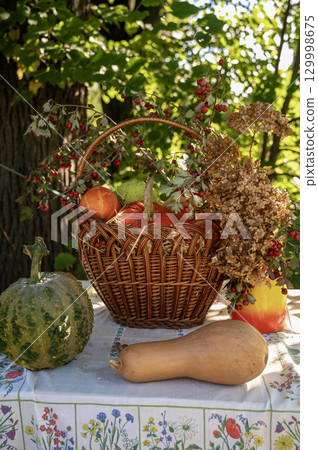 A vase filled with flowers sitting on a table A vase filled with flowers sitting on a table 129998675