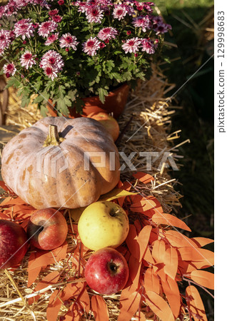 A group of fruit and vegetables on display 129998683