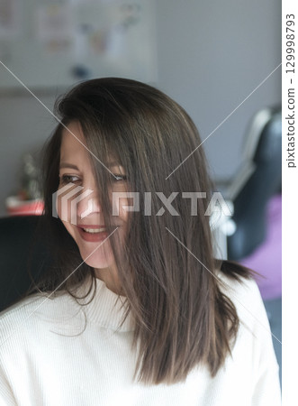 elegant woman over 40, business lady, works in the office 129998793
