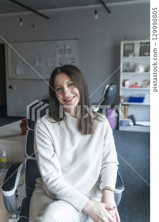 elegant woman over 40, business lady, works in the office elegant woman over 40, business lady, works in the office 129998805