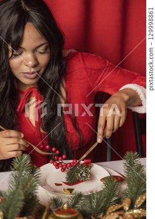dark skinned beautiful girl rejoices at christmas holiday 129998861