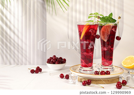 Sangria or cocktail with mint, cherry, soda, lemon and ice, restaurant and bar menu, refreshing summer and autumn drink recipe, detox diet and weight loss concept, Cold homemade lemonade Sangria or cocktail with mint, cherry, soda, lemon and ice, restaurant and bar menu, refreshing summer and autumn drink recipe, detox diet and weight loss concept, Cold homemade lemonade 129998969