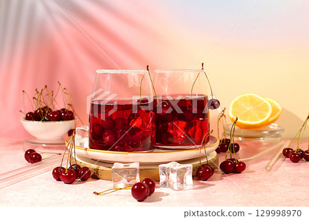 Refreshing homemade lemonade cocktail, mojito with cherry, mint, ice and lemon, weight loss concept,detox water with fruit flavor. Healthy and natural food, advertising for bar and cafe,autumn banner. Refreshing homemade lemonade cocktail, mojito with cherry, mint, ice and lemon, weight loss concept,detox water with fruit flavor. Healthy and natural food, advertising for bar and cafe,autumn banner. 129998970