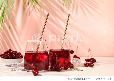 Refreshing homemade lemonade cocktail,mojito with cherry, mint, ice and lemon, weight loss concept, detox water with fruit flavor. Healthy and natural food, advertising for bar and cafe,autumn banner 129998971