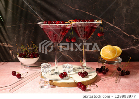 Margarita with cherry, mint, ice with tequila, vodka on elegant background, still life with drinks minimalist concept for bar, soft and alcoholic drink for weight loss, advertising banner for cafe 129998977