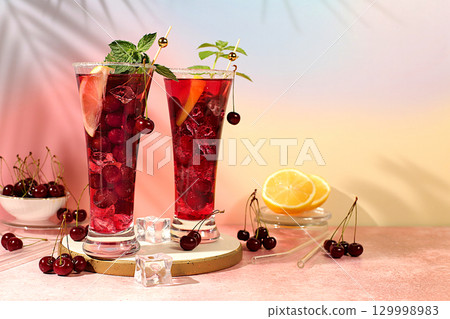 Sangria or cocktail with mint, cherry, soda, lemon and ice, restaurant and bar menu, refreshing summer and autumn drink recipe, detox diet and weight loss concept, Cold homemade lemonade Sangria or cocktail with mint, cherry, soda, lemon and ice, restaurant and bar menu, refreshing summer and autumn drink recipe, detox diet and weight loss concept, Cold homemade lemonade 129998983