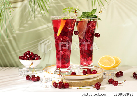 Sangria or cocktail with mint, cherry, soda, lemon and ice, restaurant and bar menu, refreshing summer and autumn drink recipe, detox diet and weight loss concept, Cold homemade lemonade Sangria or cocktail with mint, cherry, soda, lemon and ice, restaurant and bar menu, refreshing summer and autumn drink recipe, detox diet and weight loss concept, Cold homemade lemonade 129998985