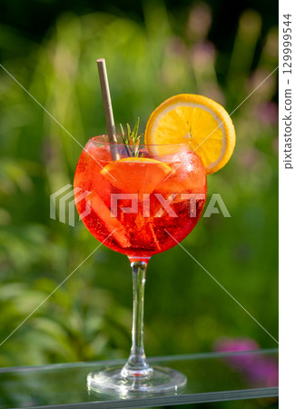 glass of classic red spritz cocktail 129999544