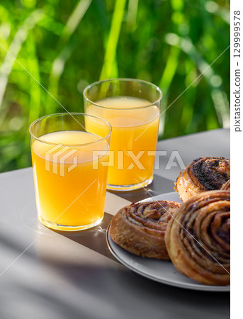 orange juice and pastries orange juice and pastries 129999578
