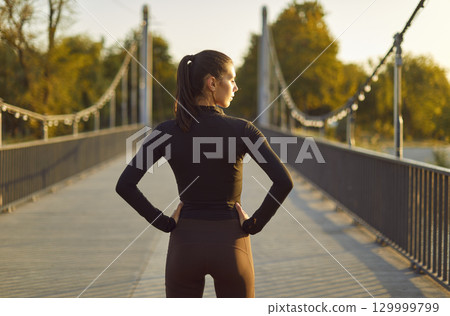 Athletic Woman Runner During A Break At City Park Athletic Woman Runner During A Break At City Park 129999799
