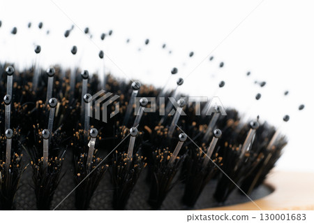 Close-up of the pins on a boar bristle hairbrush 130001683