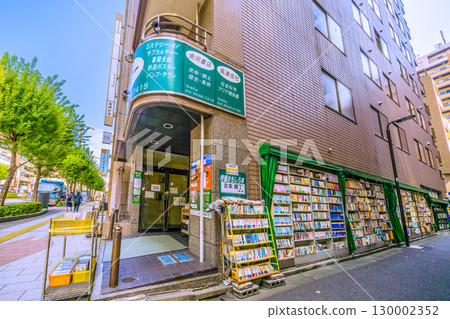 Tokyo cityscape in Japan: Kanda Jinbocho, a used bookstore district. Bookshelves line the walls on the street side... (August 21st) 130002352