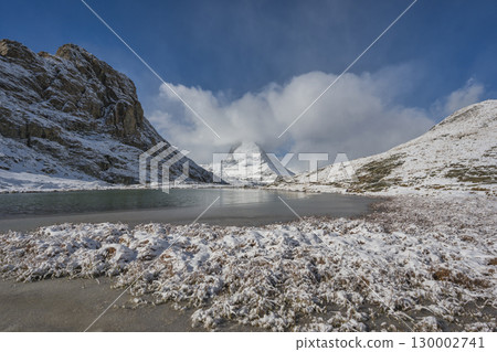 Zermatt Switzerland nature landscape at Matterhorn mountain peak and Riffelsee lake in winter season Zermatt Switzerland nature landscape at Matterhorn mountain peak and Riffelsee lake in winter season 130002741