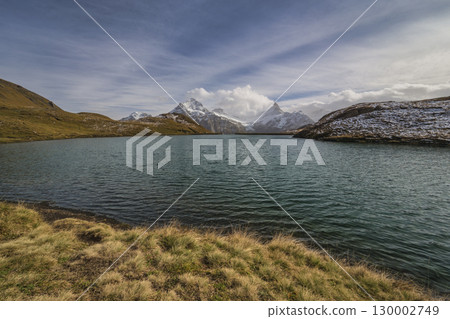 Grindelwald First Switzerland at Bachalpsee Lake (Bachsee) with Swiss Alps Wetterhorn and Schreckhorn peak 130002749