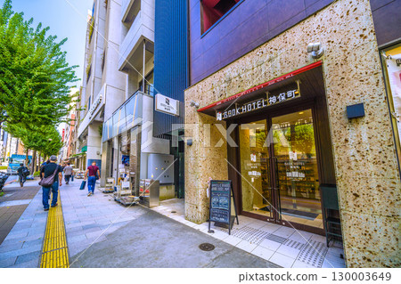 Tokyo cityscape in Japan: Kanda Jinbocho, a used bookstore district with shops lined up facing north, and BOOK HOTEL Jinbocho... (August 21st) Tokyo cityscape in Japan: Kanda Jinbocho, a used bookstore district with shops lined up facing north, and BOOK HOTEL Jinbocho... (August 21st) 130003649