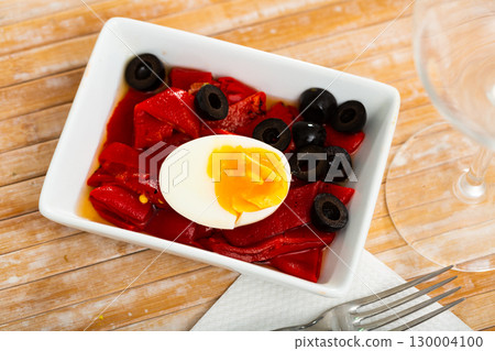 Salad of baked sweet peppers with boiled egg and olives 130004100
