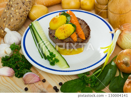 Beef patty with baked new potatoes, carrots Beef patty with baked new potatoes, carrots 130004141