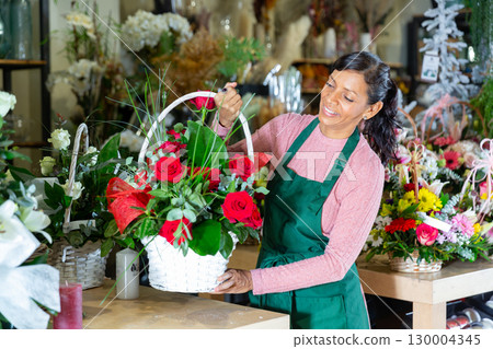 Latin woman florist in flower shop 130004345