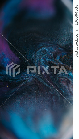 Ink spill. Neon background. Defocused purple silver blue black colorful glitter flow particles spreading on acrylic abstraction. Ink spill. Neon background. Defocused purple silver blue black colorful glitter flow particles spreading on acrylic abstraction. 130004936