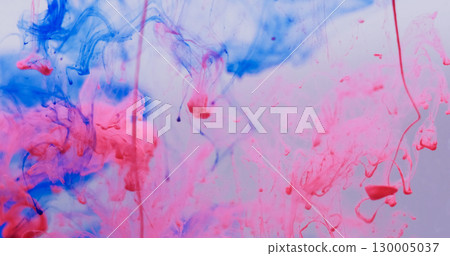 Smoke water. Mist paint. Blue pink red ink dripping in liquid. Art blob dye haze dissolving defocused color explosion white background. 130005037