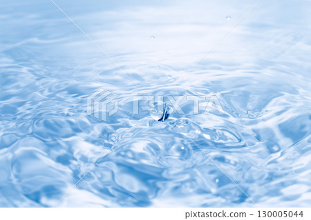 Drops of water falling on the surface of the water. 130005044