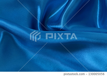 Blue fabric cloth texture for background and design art work, beautiful crumpled pattern of silk or linen. Blue fabric cloth texture for background and design art work, beautiful crumpled pattern of silk or linen. 130005056