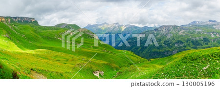 Grossglockner, Austria Breathtaking Panorama of Lush Green Alpine Meadows and Distant Peaks Grossglockner, Austria Breathtaking Panorama of Lush Green Alpine Meadows and Distant Peaks 130005196