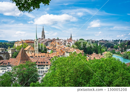 Bern, Switzerland A Picturesque View of the Old City with River and Lush Greenery, Summer Day Bern, Switzerland A Picturesque View of the Old City with River and Lush Greenery, Summer Day 130005208