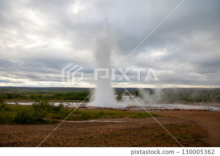 Strokkur geyser at Great Geysir in the Golden Circle, a tourist attraction in the Nordic island nation of Iceland 130005362