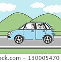 A mother drives with her children on a road trip with a mountain view in the background 130005470