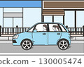 A car driven by a mother with her child through a shopping district in the city 130005474
