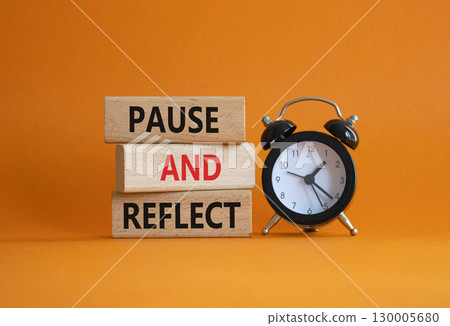 Pause and Reflect symbol. Concept words Pause and Reflect on wooden blocks. Beautiful orange background with alarm clock. Business and Pause and Reflect concept. Copy space. Pause and Reflect symbol. Concept words Pause and Reflect on wooden blocks. Beautiful orange background with alarm clock. Business and Pause and Reflect concept. Copy space. 130005680