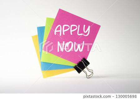 Apply now symbol. Concept word Apply now on sticky note. Beautiful white background. Business and Apply now concept. Copy space Apply now symbol. Concept word Apply now on sticky note. Beautiful white background. Business and Apply now concept. Copy space 130005698