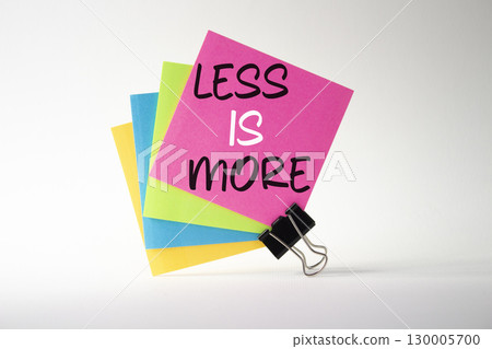 Less is More symbol. Sticky Notes with Concept words Less is More. Beautiful white background. Business and Less is More concept. Copy space. Less is More symbol. Sticky Notes with Concept words Less is More. Beautiful white background. Business and Less is More concept. Copy space. 130005700