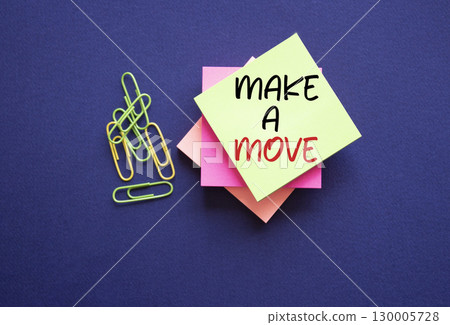 Make a Move symbol. Sticky Notes with Concept words Make a Move. Beautiful deep blue background. Business and Make a Move concept. Copy space. 130005728