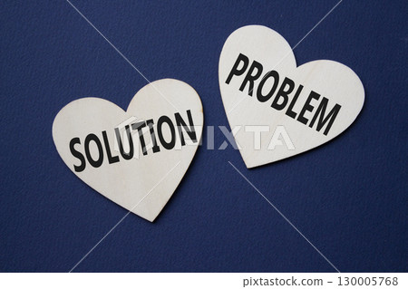 Solution vs Problem symbol. Concept word Solution vs Problem on wooden hearts. Beautiful deep blue background. Business and Solution vs Problem concept. Copy space 130005768