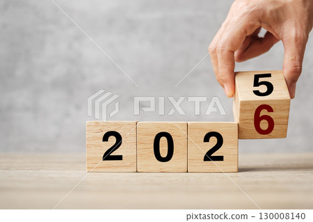 hand flipping block 2025 to 2026 text on table. Resolution, strategy, plan, goal, motivation, reboot, business and New Year holiday concepts hand flipping block 2025 to 2026 text on table. Resolution, strategy, plan, goal, motivation, reboot, business and New Year holiday concepts 130008140