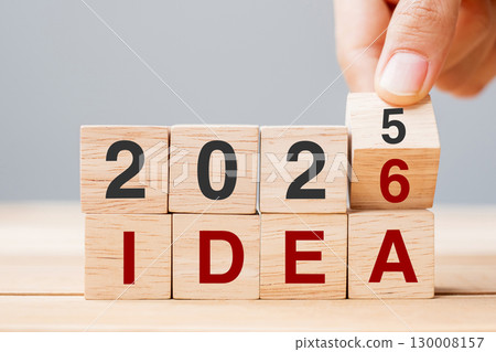 hand flipping block 2025 to 2026 IDEA text on table. goal, Resolution, strategy, plan, motivation, reboot, business and New Year holiday concepts hand flipping block 2025 to 2026 IDEA text on table. goal, Resolution, strategy, plan, motivation, reboot, business and New Year holiday concepts 130008157