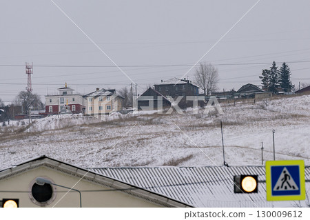 Private residential houses on a snowy hill on the outskirts of the city. Private residential houses on a snowy hill on the outskirts of the city. 130009612