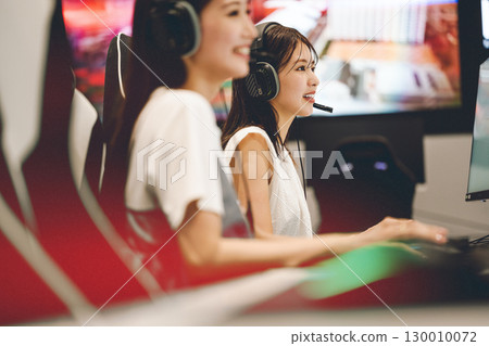 Young woman participating in a game at an e-sports tournament 130010072