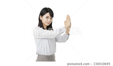 Businesswoman posing as if she's sorry (white background) 130010695