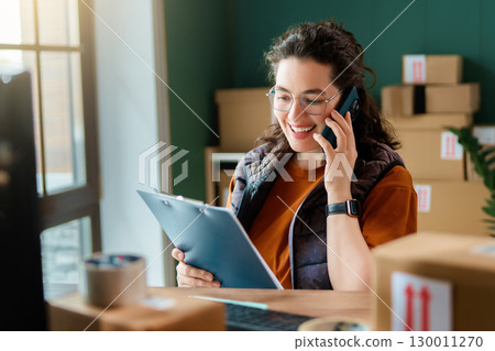 Woman working in a warehouse Woman working in a warehouse 130011270