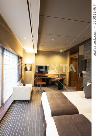 Urban luxury hotel suite bedroom (daytime view, luxury room with attached workspace) 130011467