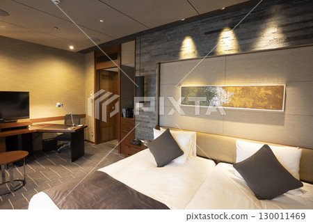 Urban luxury hotel suite bedroom (daytime view, luxury room with attached workspace) 130011469