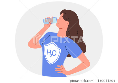 Woman drinks water from glass, dressed in t-shirt with h2o logo, uses aqua to cleanse of toxins 130011804
