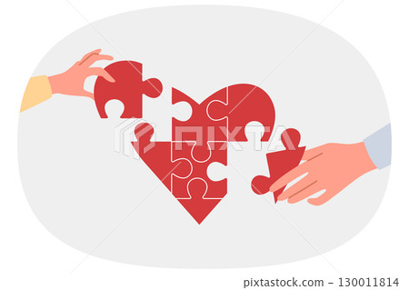 Heart symbolizing charity and mercy consists of puzzles carefully assembled by hands of people 130011814